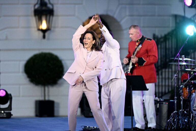 TOPSHOT - US Vice President Kamala Harris dances with US singer Kirk Franklin during a Juneteenth Concert in the South Lawn of the White House in Washington, DC on June 10, 2024. (Photo by Brendan SMIALOWSKI / AFP) (Photo by BRENDAN SMIALOWSKI/AFP via Getty Images)