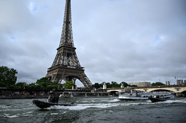 FRANCE-OLY-PARIS-2024
Police boats participate in a technical navigation rehearsal on the Seine river for the opening ceremony of the Paris 2024 Olympic Games, in Paris, on June 17, 2024. (Photo by JULIEN DE ROSA / AFP) (Photo by JULIEN DE ROSA/AFP via Getty Images)