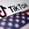 U.S. flag is placed on a TikTok logo in this illustration taken March 20, 2024. REUTERS/Dado Ruvic/Illustration/File Photo