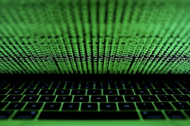 A computer keyboard lit by a displayed cyber code is seen in this illustration picture taken on March 1, 2017. REUTERS/Kacper Pempel/Illustration/File Photo