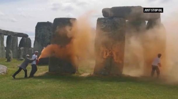 Screenshot of video showing vandals spray painting Stonehenge