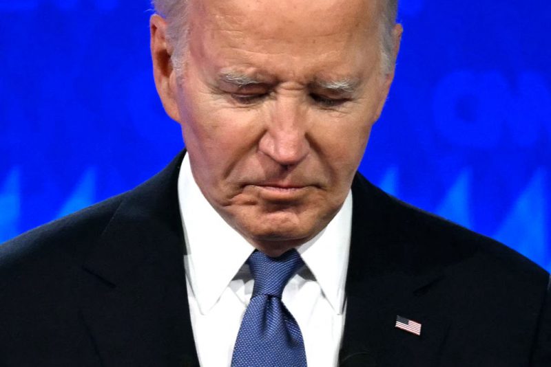 TOPSHOT - US President Joe Biden looks down as he participates in the first presidential debate of the 2024 elections with former US President and Republican presidential candidate Donald Trump at CNN's studios in Atlanta, Georgia, on June 27, 2024. (Photo by Andrew CABALLERO-REYNOLDS / AFP) (Photo by ANDREW CABALLERO-REYNOLDS/AFP via Getty Images)