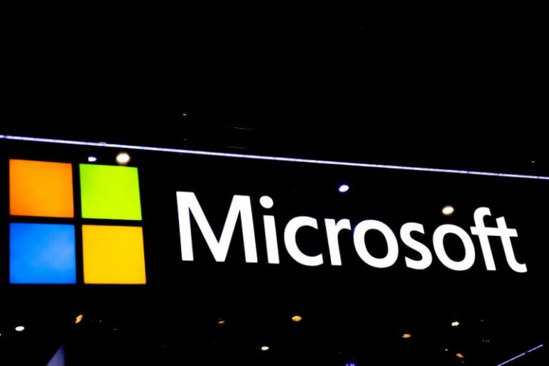 BARCELONA, SPAIN - FEBRUARY 28: A logo sits illuminated outside the Microsoft booth at the SK telecom booth on day 1 of the GSMA Mobile World Congress on February 28, 2022 in Barcelona, Spain. The annual Mobile World Congress hosts some of the world's largest communications companies, with many unveiling their latest phones and wearables gadgets like foldable screens. (Photo by David Ramos/Getty Images)