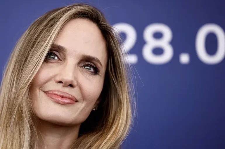 Cast member Angelina Jolie poses during a photocall for the movie "Maria", in competition, at the 81st Venice Film Festival, Venice, Italy, August 29, 2024. REUTERS/Yara Nardi