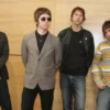 Members of British rock band Oasis rhythm guitarist Gem Archer, lead guitarist Noel Gallagher, bass guitarist Andy Bell and lead vocals Liam Gallagher pose during a news conference in Hong Kong February 25, 2006. They will hold a concert "Oasis-Live in Hong Kong" on Saturday night. REUTERS/Paul Yeung/File Photo