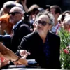 Director Tim Burton signs autographs, on the day of a photocall for the film "Beetlejuice Beetlejuice", which is screening out of competition, at the 81st Venice Film Festival, Venice, Italy, August 28, 2024. REUTERS/Yara Nardi