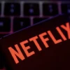 Smartphone with Netflix logo is placed on a keyboard in this illustration taken April 19, 2022. REUTERS/Dado Ruvic/File Photo