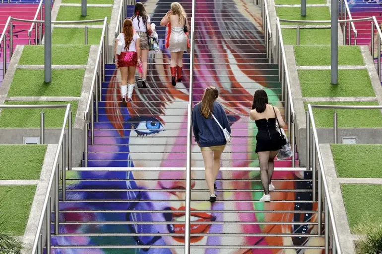 People walk on the 'Swiftie Steps' ahead of a Taylor Swift concert, following the cancellation of three Taylor Swift concerts in Vienna because of a planned attack, at Wembley Stadium in London, Britain, August 15, 2024. REUTERS/Toby Melville/File Photo