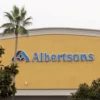 The Albertsons logo is seen on an Albertsons grocery store, as Kroger agrees to buy rival Albertsons in a deal to combine the two supermarket chains, in Riverside, California, U.S., October 14, 2022. REUTERS/Aude Guerrucci/File Photo