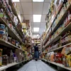 A woman shops for groceries at El Progreso Market in the Mount Pleasant neighborhood of Washington, D.C., U.S., August 19, 2022. REUTERS/Sarah Silbiger/File Photo