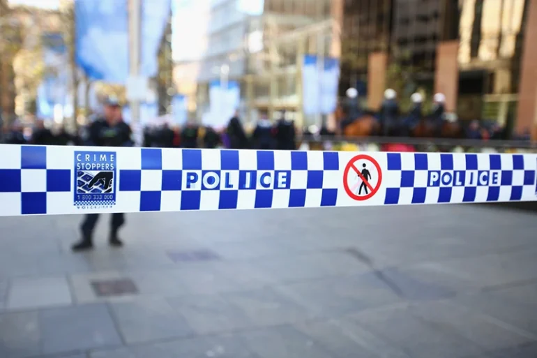 Police tape is seen to control protester movements as 'Reclaim Australia' protesters and counter protesters gather on July 19, 2015 in Sydney, Australia. 'Reclaim Australia' grassroots rallies are being held across Australia to protest the alleged 'Islamisation' of Australia. (Photo by Mark Kolbe/Getty Images)