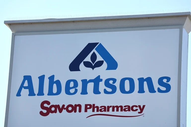 The Albertsons logo is displayed at an Albertsons supermarket on August 26, 2024 in Los Angeles, California. A federal judge in Oregon is hearing arguments today after the Federal Trade Commission and several states sued to block the planned merger between grocery chains Kroger and Albertsons. (Photo by Mario Tama/Getty Images)