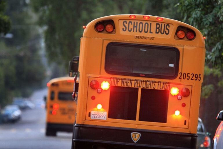 PASADENA, CA - OCTOBER 10: School buses drive down teh road to pick up children before classes begin on October 10, 2008 in Pasadena, California. California State Treasurer Bill Lockyer has warned that California cash revenues will run out by the end of the month. If that happens, 5,000 California cities, counties, and school districts will face job layoffs and payments for law enforcement agencies, nursing homes, teachers, and other services and government entities could be suspended. A worldwide credit crunch threatens to derail state plans for a routine 7 billion dollar loan to even out the tax flow into the state treasury. Just two weeks after state lawmakers came to agreement, after months of haggling on a record-overdue state budget, California Gov. Arnold Schwarzenegger is warning of future cuts to the state budget to deal with skyrocketing financial problems. A frozen credit market and revenues for the first quarter of the fiscal year that fell more than a billion dollars short of previous projections are causing the governor and state legislative leaders scrabbling to deal with a new budget mess. (Photo by David McNew/Getty Images)