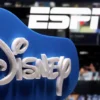 A 3D printed Disney logo is seen in front of the ESPN+ logo in this illustration taken on July 13, 2021. REUTERS/Dado Ruvic/Illustration/File Photo