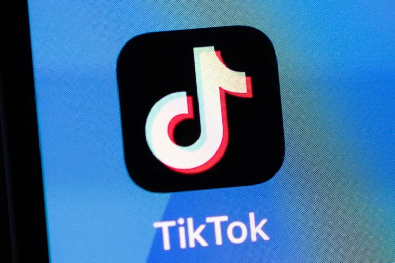 In this photo illustration, the TikTok app logo is displayed on an iPhone on February 28, 2023 in London, England. This week, the US government and European Union's parliament have announced bans on installing the popular social media app on staff devices. (Photo by Dan Kitwood/Getty Images)