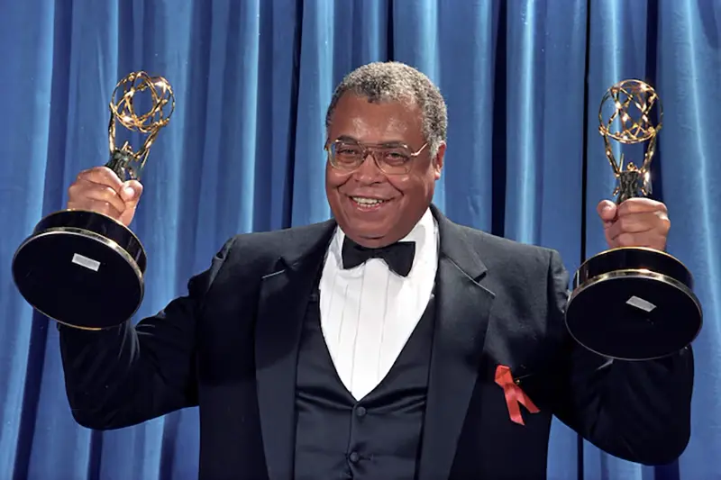 James Earl Jones holds up the two Emmy Awards he won won for Outstanding Lead Actor in a Drama Series for "Gabriel's Fire", and Outstanding Supporting Actor in a Mini-Series or Special for the TNT movie "Heat Wave" in Los Angeles, 1991. REUTERS/Mircovich/File Photo