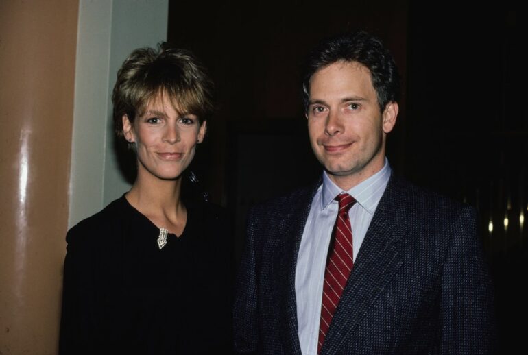 Jamie Lee Curtis and Christopher Guest posing together at an event in the United States during the 1980s