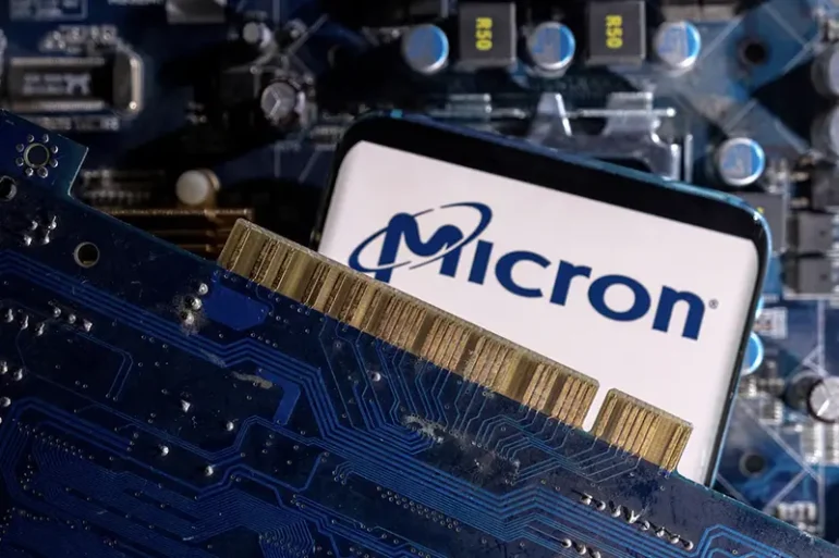 A smartphone with a displayed Micron logo is placed on a computer motherboard in this illustration taken March 6, 2023. REUTERS/Dado Ruvic/Illustration/File Photo