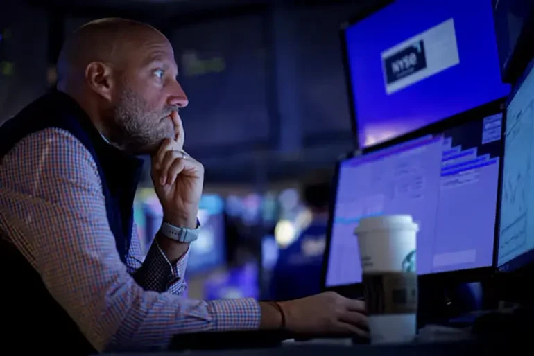 A specialist trader works inside a post on the floor at the New York Stock Exchange (NYSE) in New York City, U.S., September 9, 2024. REUTERS/Brendan McDermid/File Photo