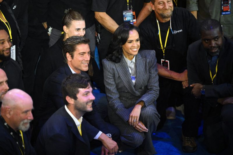 US broadcaster David Muir (L) and US broadcaster Linsey Davis (R) pose for pictures with ABC News crew members at the end of a presidential debate with US Vice President and Democratic presidential candidate Kamala Harris and former US President and Republican presidential candidate Donald Trump at the National Constitution Center in Philadelphia, Pennsylvania, on September 10, 2024. (Photo by SAUL LOEB / AFP) (Photo by SAUL LOEB/AFP via Getty Images)