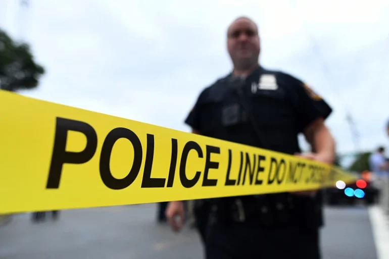 TOPSHOT-US-ATTACKS-NEW YORK-NEW JERSEY TOPSHOT - Law enforcement officers secure the area where they allegedly arrested terror suspect Ahmad Khan Rahami following a shootout in Linden, New Jersey, on September 19, 2016.16. An "armed and dangerous" Afghan-born suspect wanted in the weekend bomb attacks in New York and New Jersey was wounded Monday in a shootout with police and taken into custody. Federal investigators released a mugshot of 28-year-old Ahmad Khan Rahami, who has brown hair, brown eyes and a brown beard, saying he was last known to live in Elizabeth, a town adjacent to Newark International Airport. (Photo by Jewel SAMAD / AFP) (Photo by JEWEL SAMAD/AFP via Getty Images)