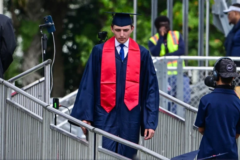 Barron Trump, son of former US President Donald Trump and former First Lady Melania Trump, takes part in his graduation at Oxbridge Academy in Palm Beach, Florida, May 17, 2024. (Photo by Giorgio VIERA / AFP) (Photo by GIORGIO VIERA/AFP via Getty Images)