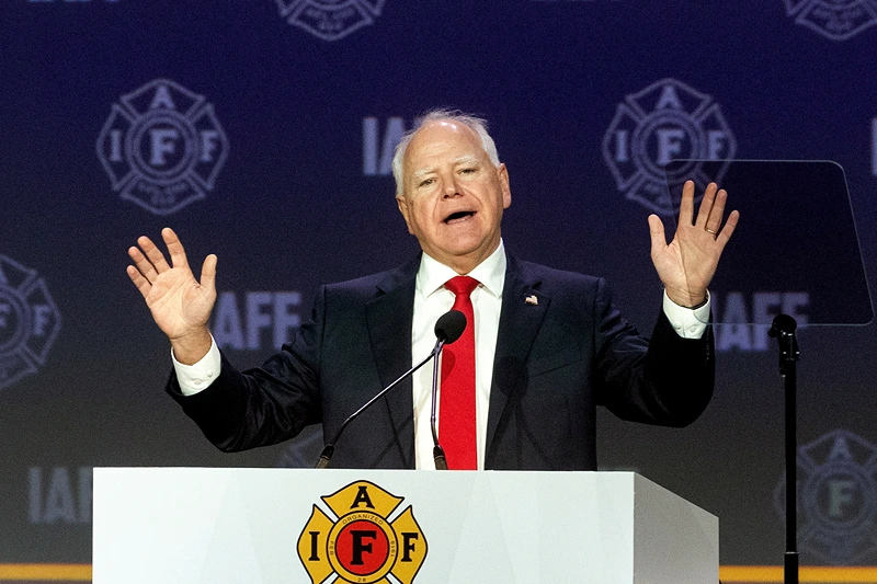 BOSTON, MASSACHUSETTS - AUGUST 28: Democratic vice presidential nominee, Minnesota Gov. Tim Walz speaks on stage during the International Association of Fire Fighters (IAFF) Convention on August 28, 2024 in Boston, Massachusetts. Gov. Walz is set to join his Democratic running mate, Vice President Kamala Harris, on a bus tour in Georgia. (Photo by Scott Eisen/Getty Images)