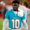 Tyreek Hill #10 of the Miami Dolphins looks on during a preseason game against the Tampa Bay Buccaneers at Raymond James Stadium on August 23, 2024 in Tampa, Florida. (Photo by Mike Ehrmann/Getty Images)