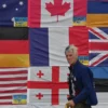 This photograph taken on Independence Square in Kyiv on June 23, 2022 shows US citizen Ryan Wesley Routh sticking up national flags of the countries helping Ukraine. US media said it was Routh, 58, who was arrested after US Secret Service agents "opened fire on a gunman" carrying an AK-47 style rifle near the boundary of Donald Trump's Florida golf course where the former president was golfing on September 15, 2024. (Photo by Sergei SUPINSKY / AFP) (Photo by SERGEI SUPINSKY/AFP via Getty Images)