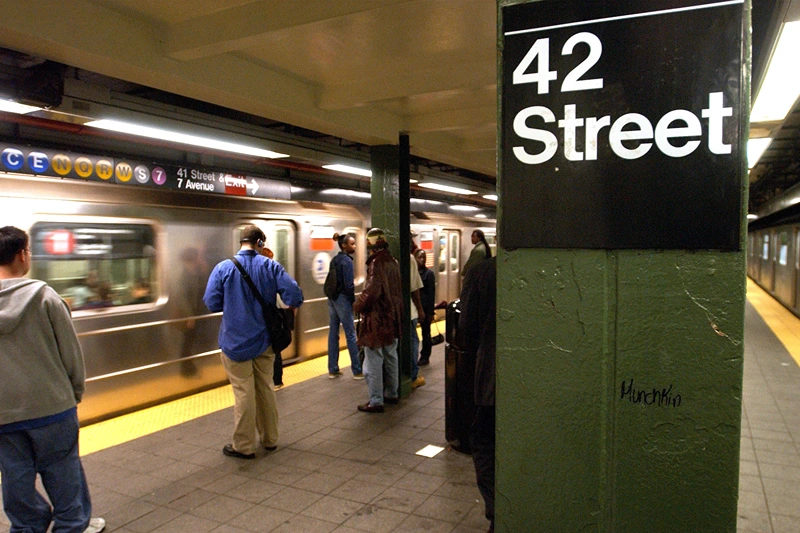 People wait for a train in a subway station June 18, 2003 in New York City. A new report by the New York Police Department (NYPD) reports that felonies are down 15 percent this year on New York's subways. The NYPD credits an increase in officers at subway stations for part of the drop in crime on trains and stations. (Photo by Spencer Platt/Getty Images)