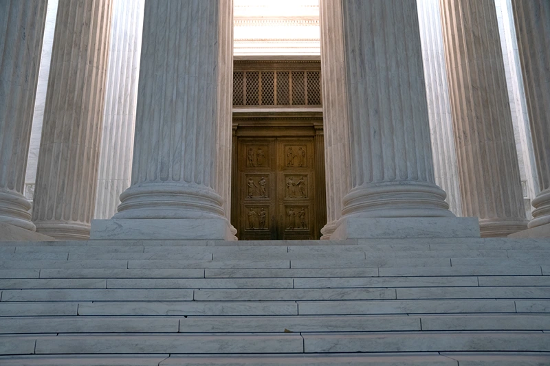 WASHINGTON, DC - OCTOBER 20: The doors to the Supreme Court in the early morning on October 20, 2020 in Washington, DC. The Supreme Court ruled on Monday that election officials in the state of Pennsylvania are allowed to count absentee ballots received after Election Day, as long as they are postmarked by November 3. (Photo by Stefani Reynolds/Getty Images)