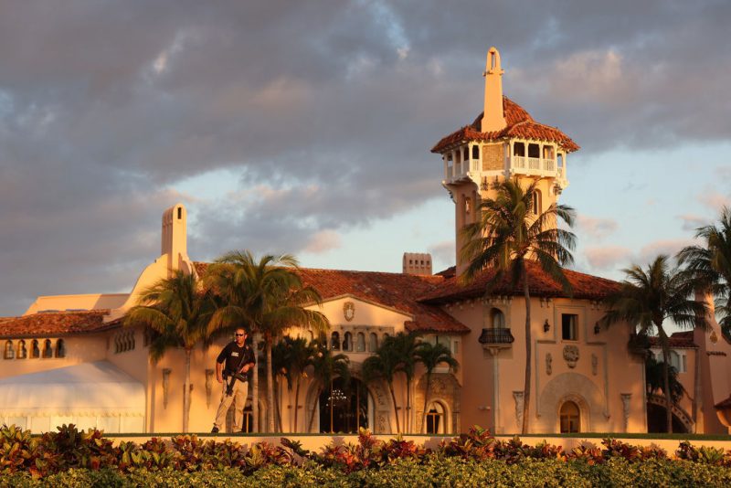 PALM BEACH, FLORIDA - MARCH 21: A Secret Service agent guards the Mar-a-Lago home of former President Donald Trump on March 21, 2023 in Palm Beach, Florida. Trump said on a social media post that he expects to be arrested in connection with an investigation into a hush-money scheme involving adult film actress Stormy Daniels and called on his supporters to protest any such move. However, it is unclear if he will be arrested or not. (Photo by Joe Raedle/Getty Images)