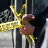 A San Mateo County Sheriff officer puts up police tape at a crime scene after a shooting at the Spanish Town shops in Half Moon Bay, California, on January 24, 2023. - A suspected gunman was in custody Monday over the killing of seven people in a rural community in northern California, just two days after a mass shooting at a Lunar New Year celebration near Los Angeles. (Photo by Samantha Laurey / AFP) (Photo by SAMANTHA LAUREY/AFP via Getty Images)