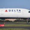 A Delta airlines aircraft landing from Los Angeles at Kingsford Smith International airport on October 31, 2021 in Sydney, Australia. Australia's COVID-19 border restrictions will ease from Monday 1 November to allow quarantine-free travel. Fully vaccinated international travellers into New South Wales and Victoria will no longer be required to enter mandatory hotel quarantine. Australian citizens will also be able to leave the country without requiring a travel exemption. Prior to the restrictions lifting on 1 November, all international arrivals are required to complete 14-days of mandatory hotel quarantine. (Photo by James D. Morgan/Getty Images)