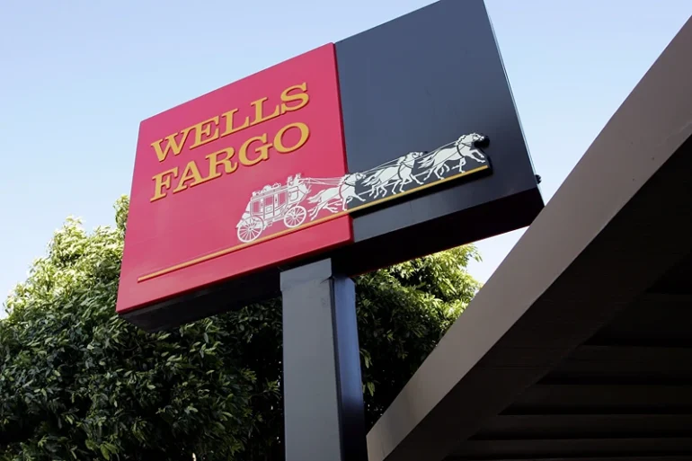 The Wells Fargo logo is seen on a sign outside of a Wells Fargo Home Mortgage branch office March 20, 2007 in San Francisco, California. San Francisco based Wells Fargo & Co. announced today that it is cutting over 500 jobs in the home mortgage divisions in South Carolina, Arizona and California that cater to high-risk borrowers. (Photo by Justin Sullivan/Getty Images)