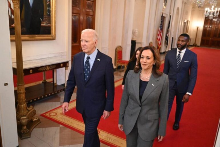 TOPSHOT - US President Joe Biden and US Vice President Kamala Harris walk to an event on gun violence in the East Room of the White House in Washington, DC on September 26, 2024. (Photo by SAUL LOEB / AFP) (Photo by SAUL LOEB/AFP via Getty Images)