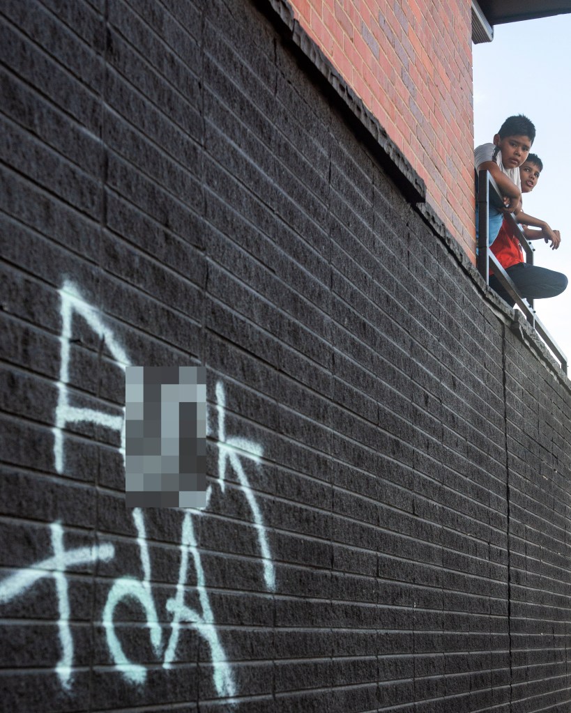 Two boys stand on an apartment balcony, Wednesday, September 4, 2024, at 1535 Moline Street, in Aurora, Colorado.