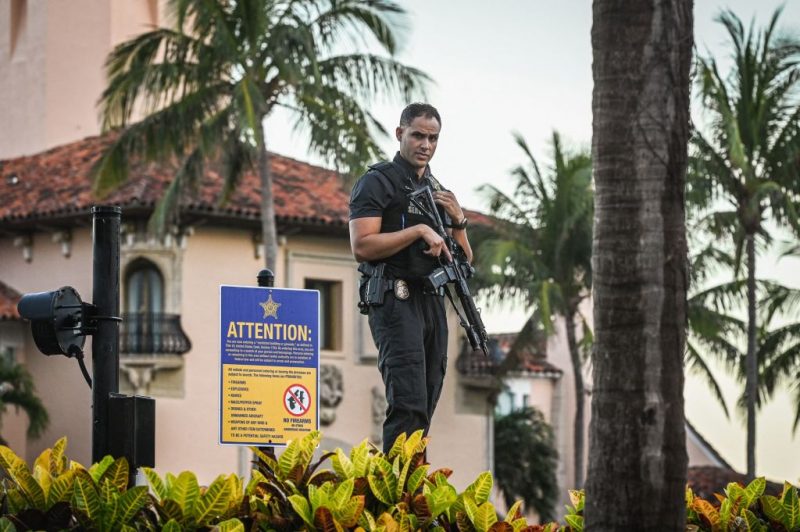 A Secret Service agent stands guard outside the Mar-a-Lago home of former President Donald Trump on March 27, 2023 in Palm Beach, Florida. - Donald Trump staged his first presidential campaign rally in Texas March 25, 2023, brushing off his potential indictment as he railed against multiple criminal probes threatening his bid for the White House. (Photo by Giorgio Viera / AFP) (Photo by GIORGIO VIERA/AFP via Getty Images)