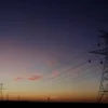 The sun sets behind power lines above the plains north of Amarillo, Texas, U.S., March 14, 2017. REUTERS/Lucas Jackson/File Photo