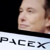 SpaceX logo and Elon Musk photo are seen in this illustration taken, December 19, 2022. REUTERS/Dado Ruvic/Illustration/File Photo