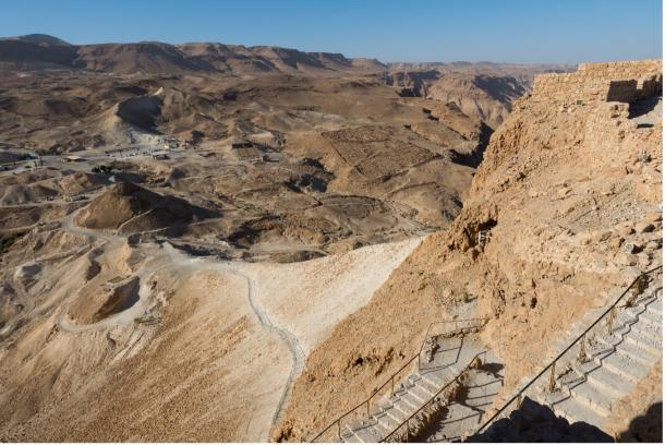 Modern day view from Masada, including the siege ramp and other Roman siege installations at the base.