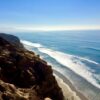 A photo shows the author's view of the Pacific Ocean from the bluffs.