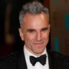 Actor Daniel Day-Lewis poses as he arrives for the British Academy of Film and Arts (BAFTA) awards ceremony at the Royal Opera House in London February 10, 2013. REUTERS/Suzanne Plunkett/File Photo