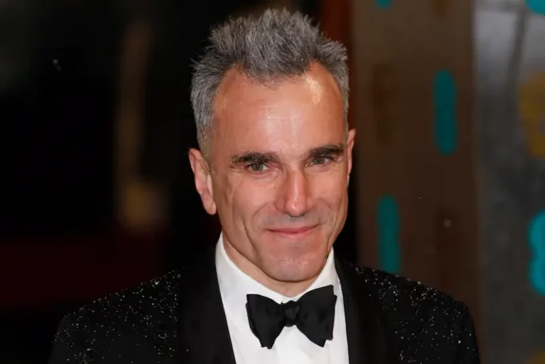 Actor Daniel Day-Lewis poses as he arrives for the British Academy of Film and Arts (BAFTA) awards ceremony at the Royal Opera House in London February 10, 2013. REUTERS/Suzanne Plunkett/File Photo