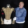 Director of music Mark Hochman poses with Michael Jackson's Tour Rehearsal "Thriller" Jacket, at Propstore in Chenies, Britain, September 30, 2024. REUTERS/Mina Kim/File Photo