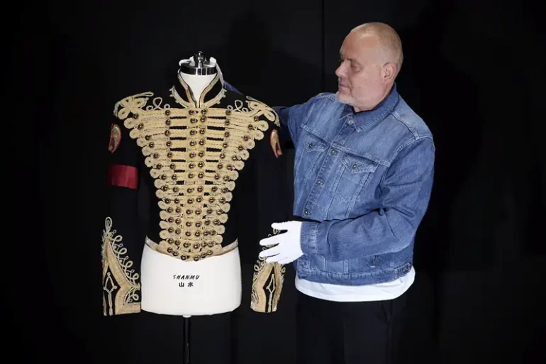 Director of music Mark Hochman poses with Michael Jackson's Tour Rehearsal "Thriller" Jacket, at Propstore in Chenies, Britain, September 30, 2024. REUTERS/Mina Kim/File Photo