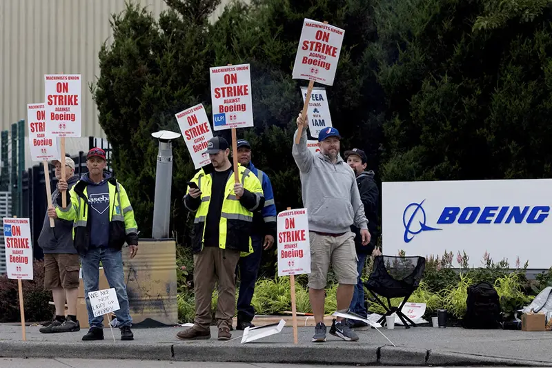 Boeing factory workers gather on a picket line during the first day of a strike near the entrance of a production facility in Renton, Washington, U.S., September 13, 2024. REUTERS/Matt Mills McKnight/File Photo