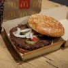 A McDonald's Quarter Pounder hamburger and coke, are seen in an illustration picture taken in New York City, U.S., October 24, 2024. REUTERS/Brendan McDermid/File Photo