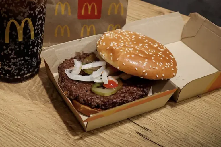 A McDonald's Quarter Pounder hamburger and coke, are seen in an illustration picture taken in New York City, U.S., October 24, 2024. REUTERS/Brendan McDermid/File Photo