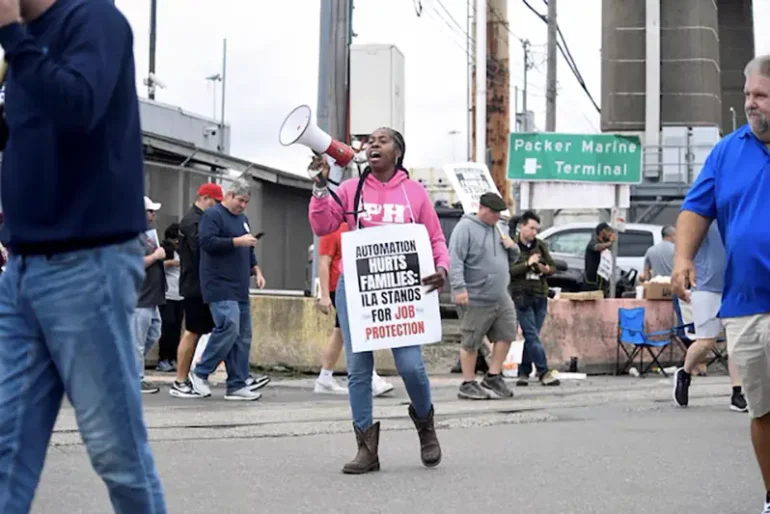 Dockworkers picket after a shipping port strike went into effect across the East Coast at the Packer Avenue Marine Terminal, Philadelphia, Pennsylvania, U.S., October 1, 2024. REUTERS/Matthew Hatcher/File Photo